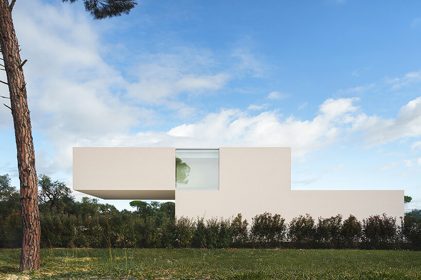 fran silvestre arquitectos stretches all-white linear residence across narrow site in spain