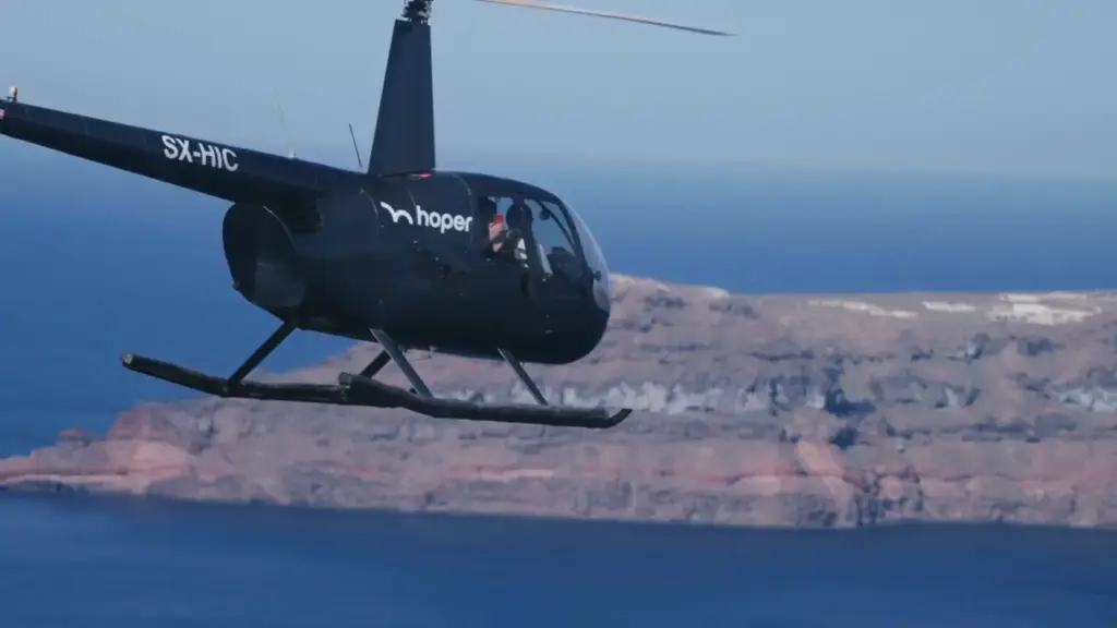hoper Expands Helicopter Routes and Private Charters in Greece hoper helicopter flying above the Aegean Sea with Greek islands in the background