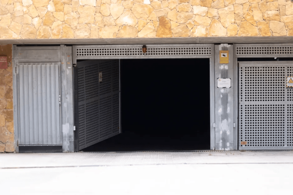 Open garage door with metal gates.