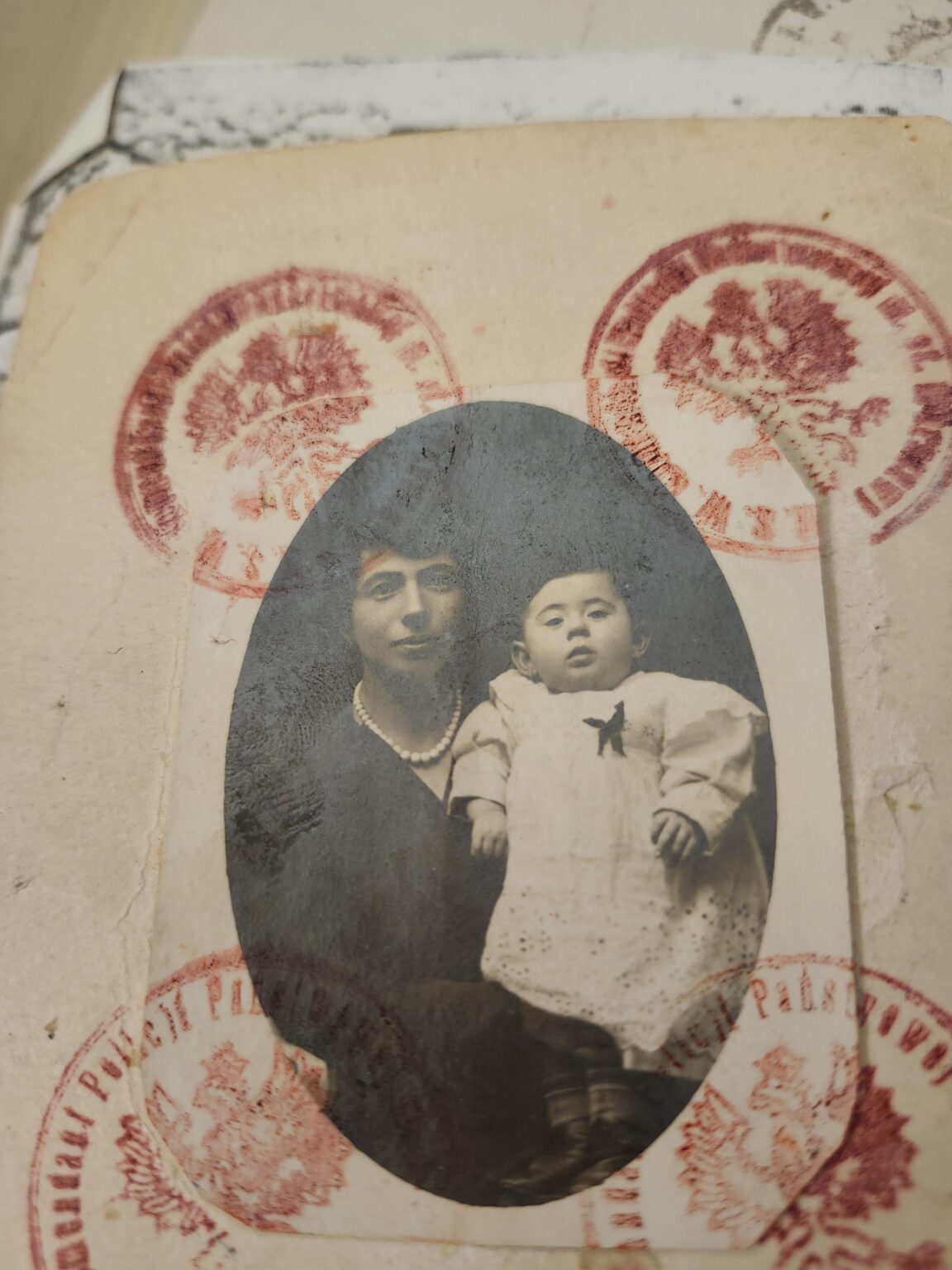 Can someone interpret the passport stamps for clues about the location? Can someone interpret the passport stamps for clues about the location?