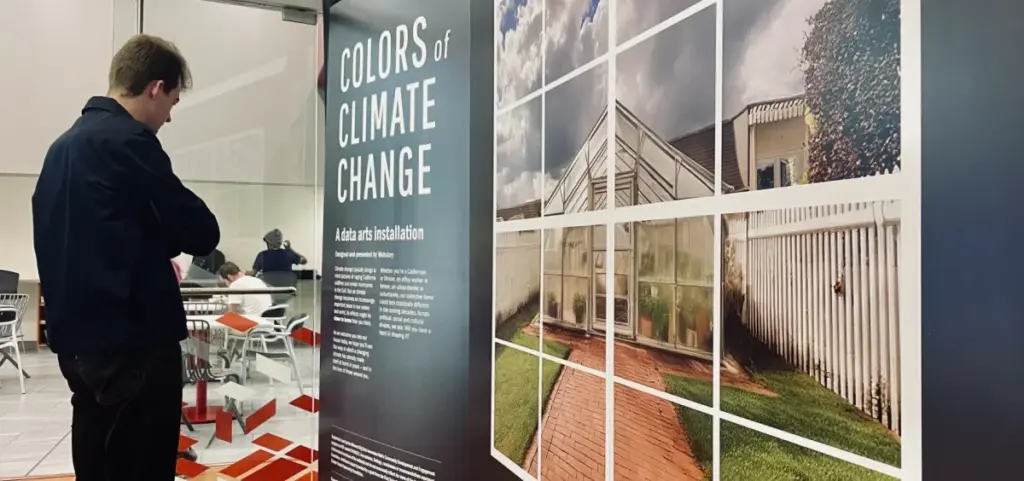 Visitors engage with the Colors of Climate Change data art exhibit