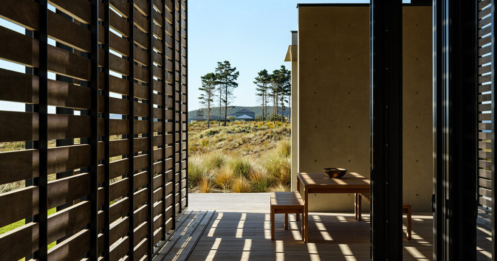 olson kundig frames new zealand coast with modern beach house