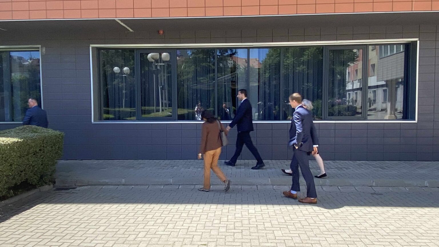 After almost an hour of meeting, Prattipati leaves the Kosovo Presidency building