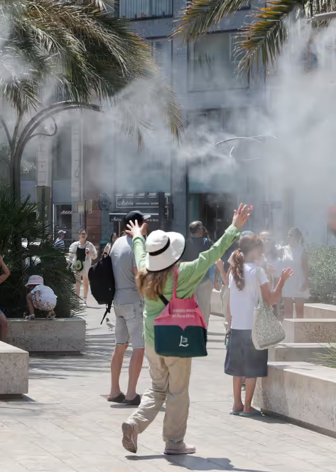 In Valencia, Spain, residents sought relief from the scorching heat by cooling off under water fountains on Sunday.