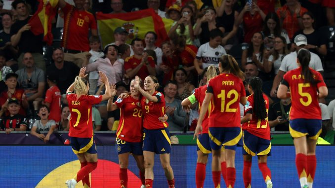 Esther Gonzalez of Spain celebrates scoring her team's fourth goal with teammates Olga Carmona and Claudia Pina