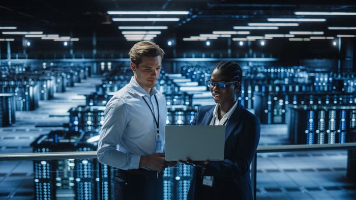 Two engineers in a data center.