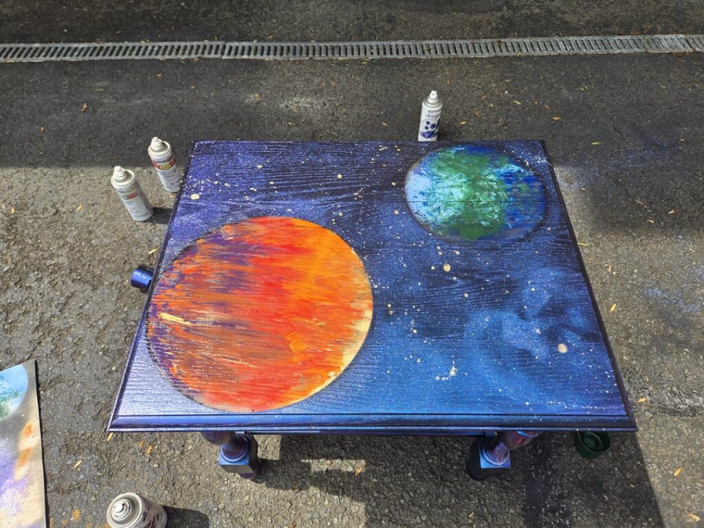 I spray-painted this table with a space scene.