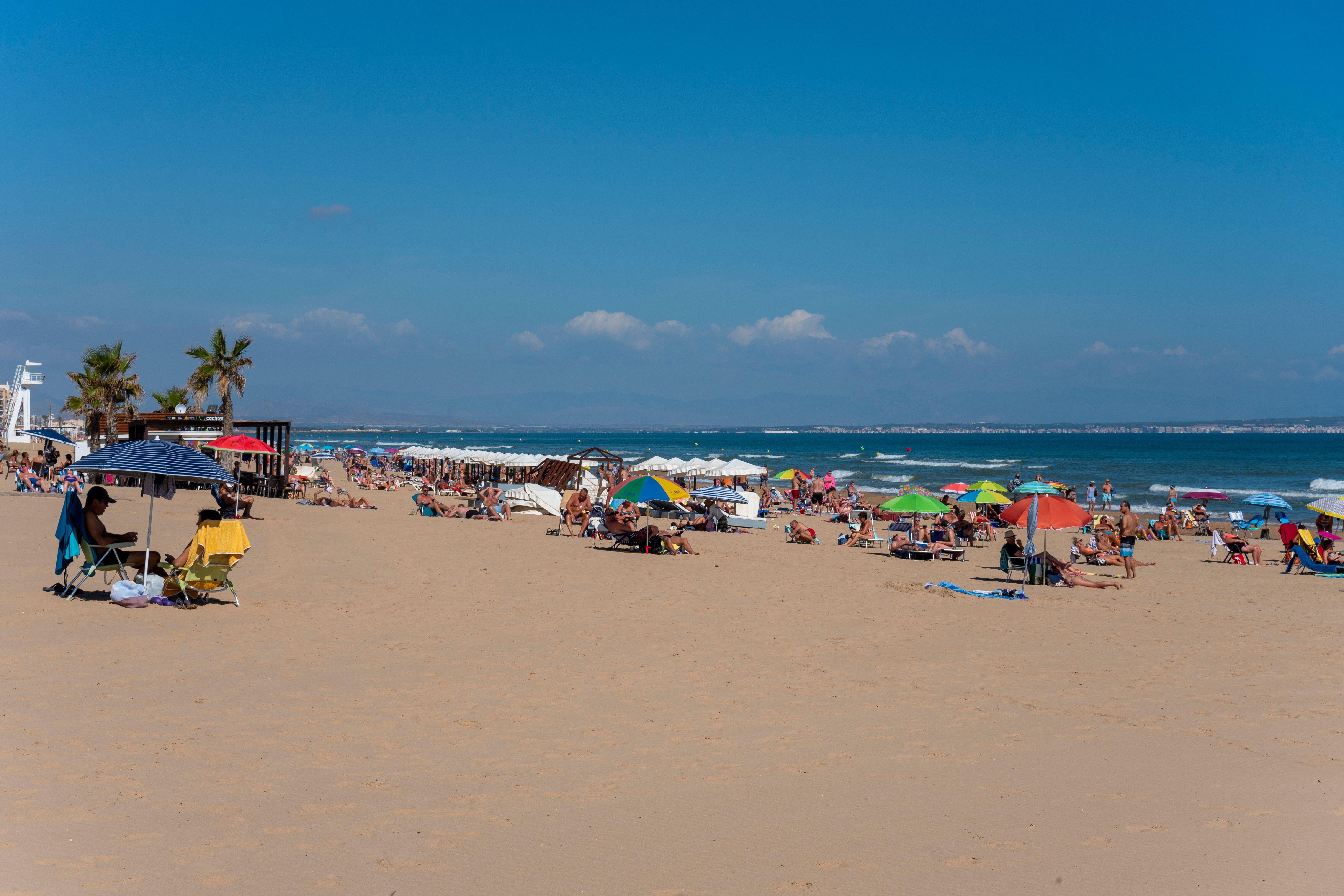 Crowded sandy beach in Guardamar del Segura, Spain.