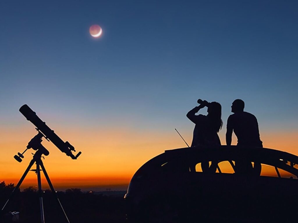 In photos of the moon, why can't I see stars in the background?