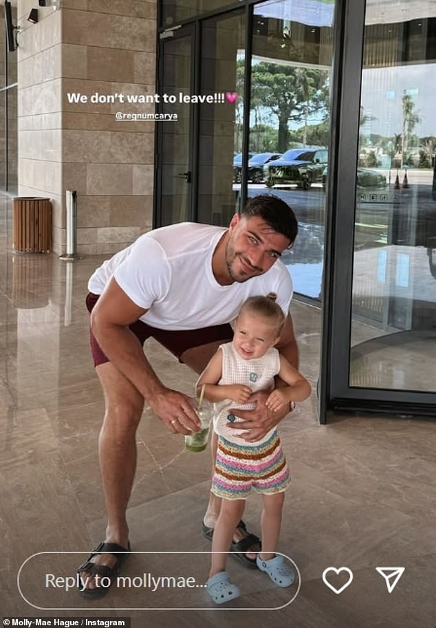 Another photo saw Tommy posing with Bambi outside their hotel with Molly-Mae writing: 'We don't want to leave!'