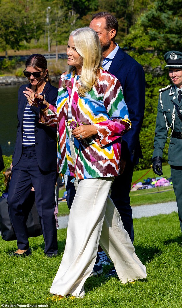The royal was dressed smartly for her first public appearance since news of Høiby's charges, pairing a bright tie-dye shirt with a white T-shirt and linen trousers