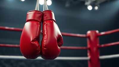 red boxing gloves hanging on the ropes (representational image) Indian boxers stuck in Patiala as visa delay hampers UK training trip ahead of World Championships
