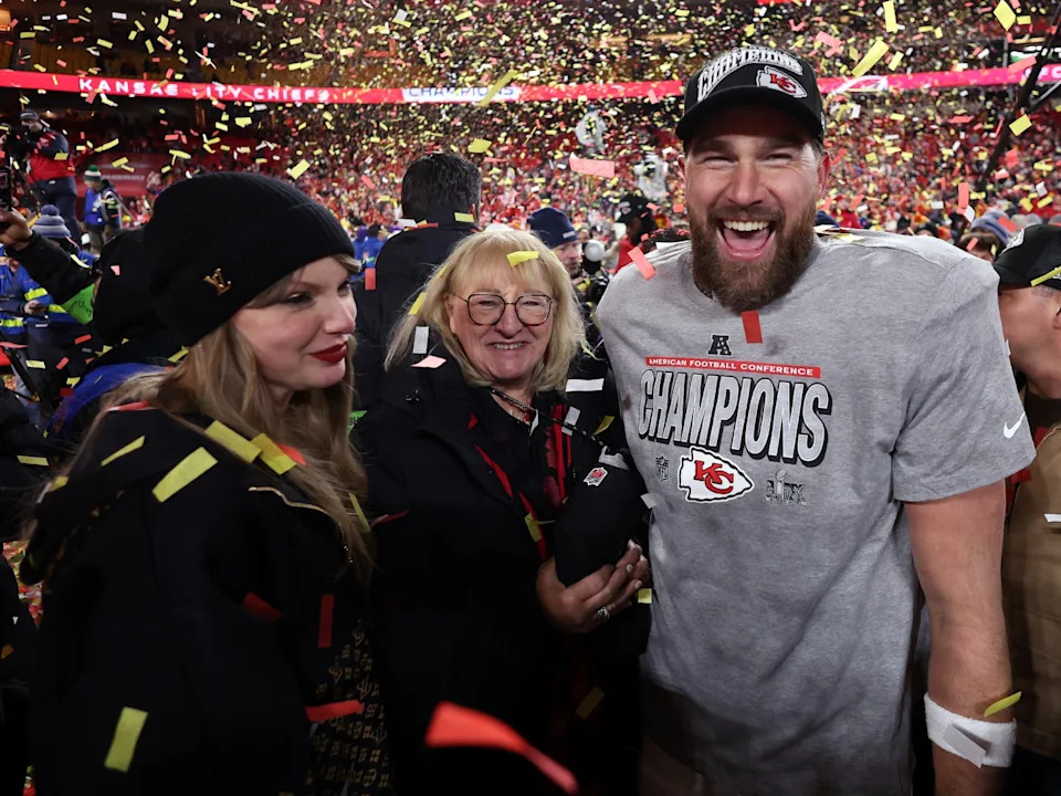 KANSAS CITY, MISSOURI - JANUARY 26: Travis Kelce #87 of the Kansas City Chiefs celebrates with Taylor Swift and mother Donna Kelce after the Chiefs defeated the Buffalo Bills 32-29 to win the AFC Championship Game at GEHA Field at Arrowhead Stadium on January 26, 2025 in Kansas City, Missouri. 
