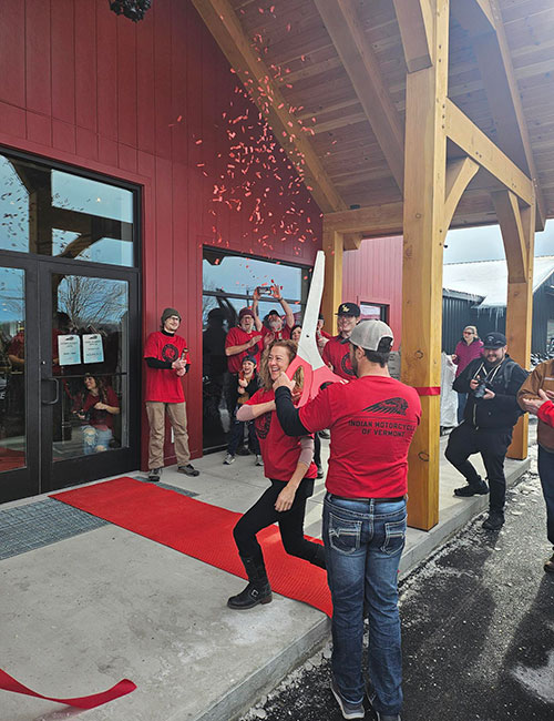 Photo: Tamara and Joey Boise cut the ribbon on the Cyclewise expansion and addition of the Indian Motorcycle brand in New Haven in February. ACEDC assisted with a BGS Building Community grant used to resite a storage  building to make room for the Indian  showroom. ACEDC also partnered with the National Bank of Middlebury and VEDA to finance the expansion.  Courtesy photos.