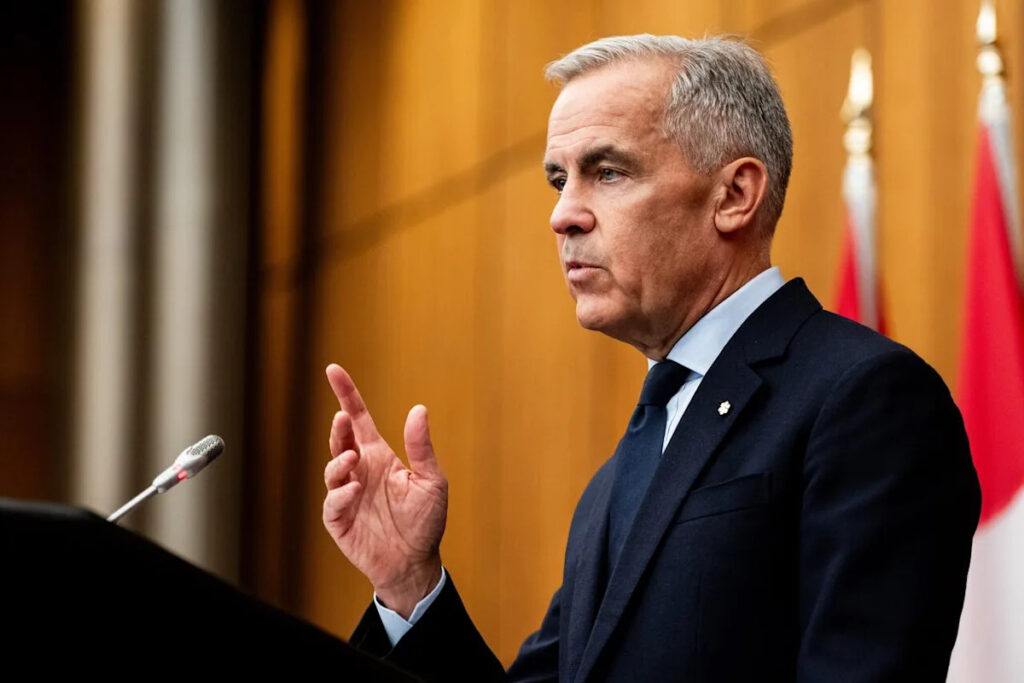 Prime Minister Mark Carney speaks to reporters at the National Press Theatre in Ottawa on Friday. He'll be travelling to Germany, Poland and Latvia next week.