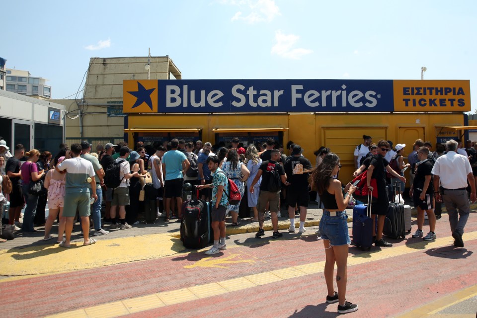 Passengers queueing outside a Blue Star Ferries ticket office.
