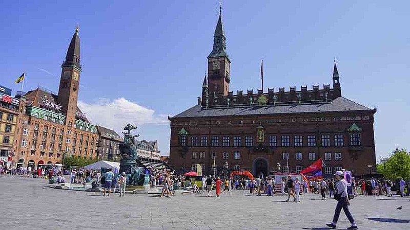 People gather in front of the Copenhagen City Hall in Copenhagen, Denmark. Friday 18 July 2025. (AP Photo/James Brooks)
