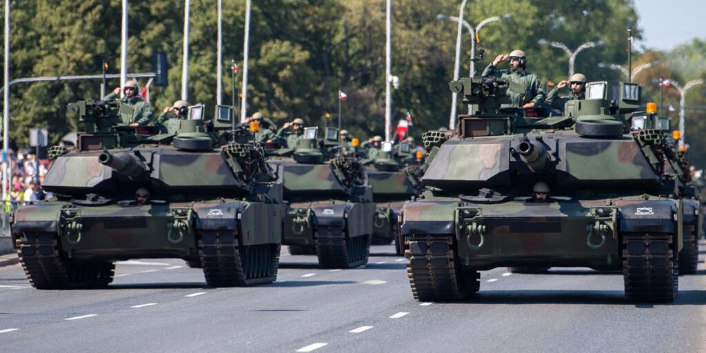 Poland displays its military power in a double parade, with German fighter jets as guests