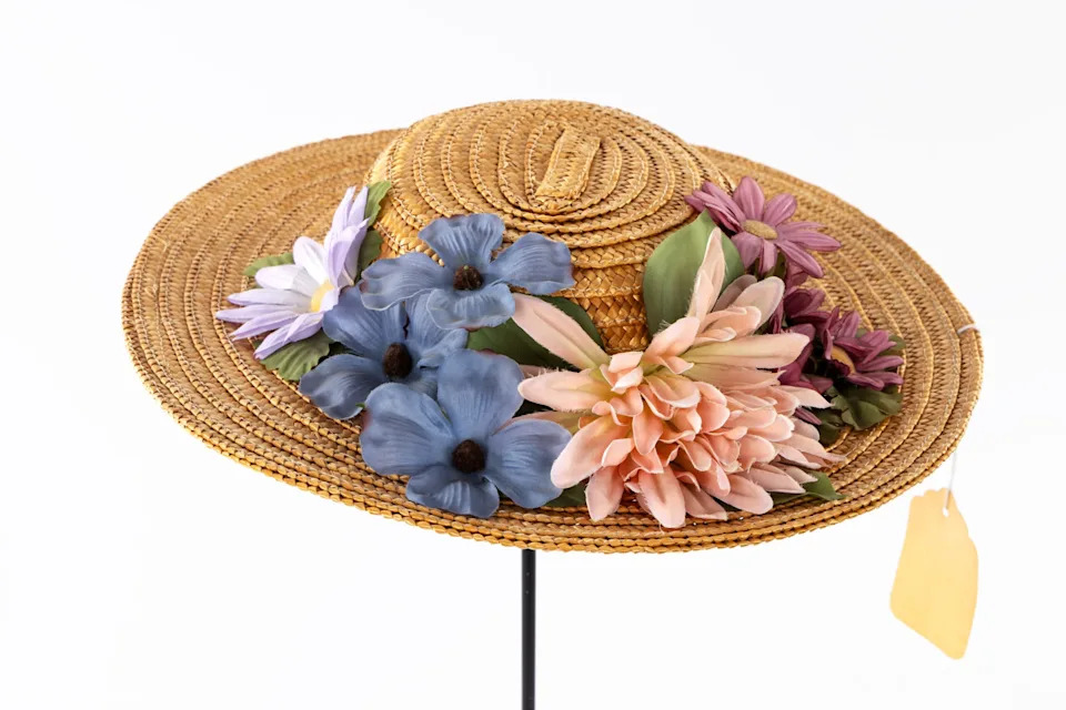Country Music Hall of Fame member Minnie Pearl wore this straw hat, decorated with cloth flowers and dangling $1.98 price tag, at her Opry debut in 1940.