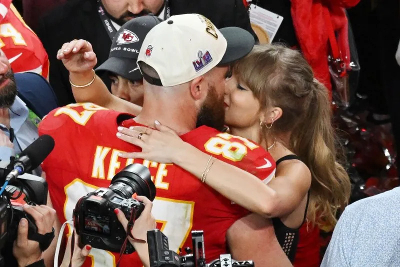 Kansas City Chiefs tight end Travis Kelce kisses his girlfriend Taylor Swift after the Chiefs defeated the San Francisco 49ers 25-22 in overtime to win Super Bowl LVIII in 2024. Swift announced her upcoming 12th album during an episode of his Kelce's podcast. File Photo by Jon SooHoo/UPI