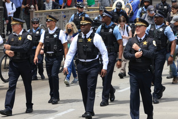 Chicago police Supt. Larry Snelling, center, and police supervisors walk ahead of marchers during a "No Kings" rally in the Loop on June 14, 2025. (John J. Kim/Chicago Tribune)
