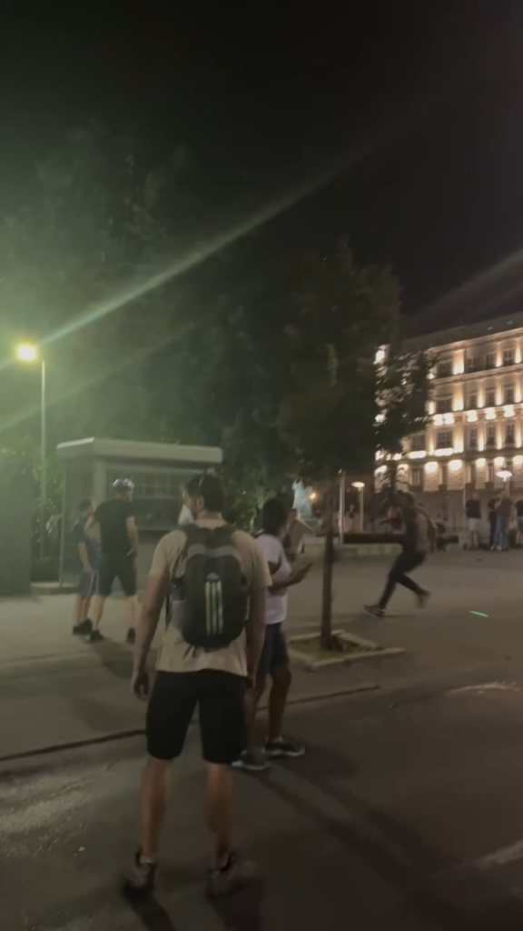 Citizens prevented arrest by police in civilian clothes.