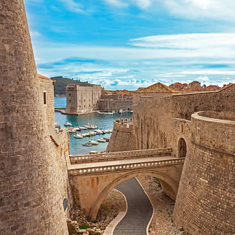 Old Town Harbor And Walls Of Dubrovnik, Croatia