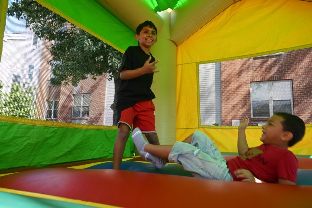 Children enjoy the bounce house during the Community Day at Penn Street sponsored by the Berks Community Health Center on Saturday, Aug. 9, 2025. (BILL UHRICH/READING EAGLE)
