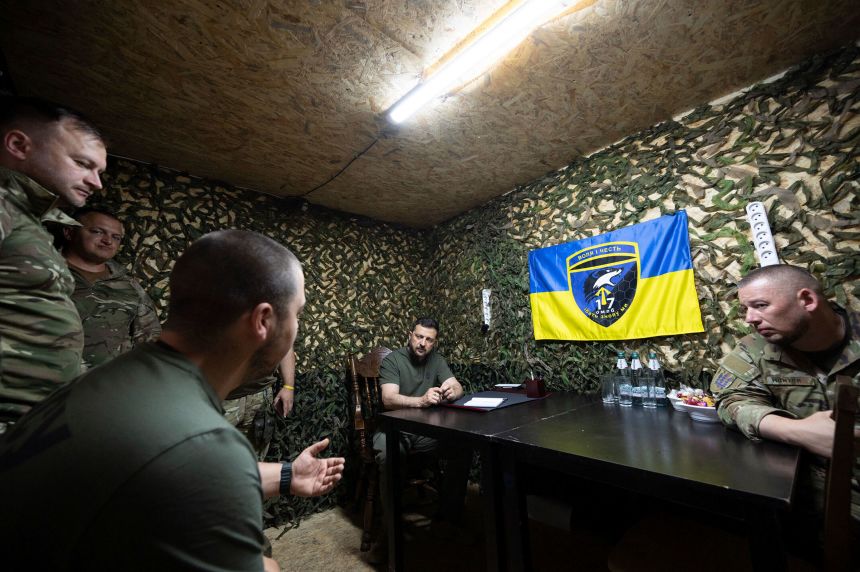 Ukrainian President Volodymyr Zelensky visits soldiers on the front lines of the Kharkiv region on August 4.