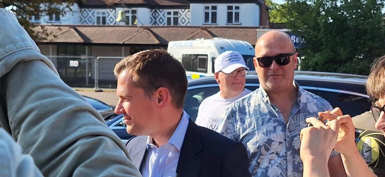 Robert Jenrick pictured with former Nazi terror chief at Epping anti-refugee protest