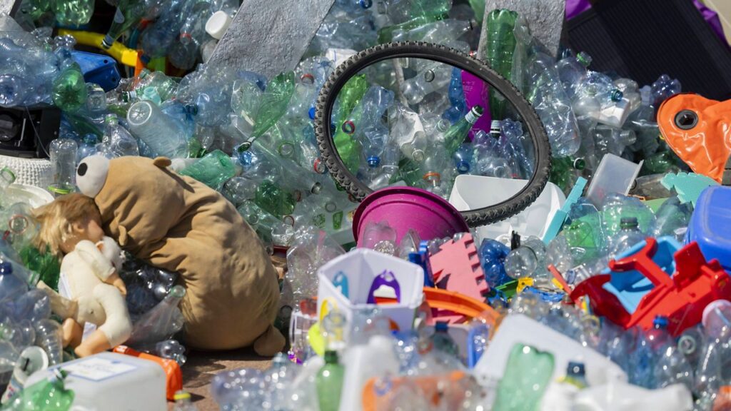 Plastic items are seen on Place des Nations in front of the European headquarters of the United Nations in Geneva, Switzerland, Monday, Aug. 4, 2025 before the second segment of the fifth session of the Intergovernmental Negotiating Committee on Plastic Pollution (INC-5.2). (Salvatore Di Nolfi/Keystone via AP)