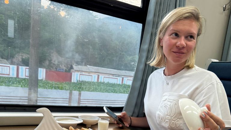Russian tourist Anastasiya Samsonova enjoying a meal on a train in North Korea. Pic: Anastasiya Samsonova