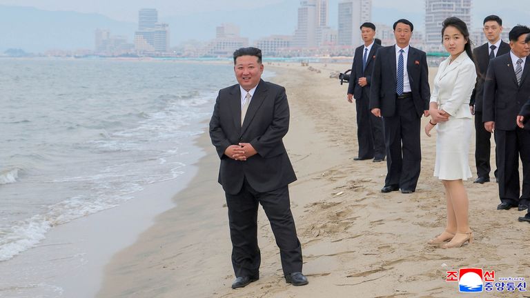 North Korean leader Kim Jong Un and his daughter Kim Ju Ae stand on the beach in Wonsan.
Pic: KCNA/Reuters