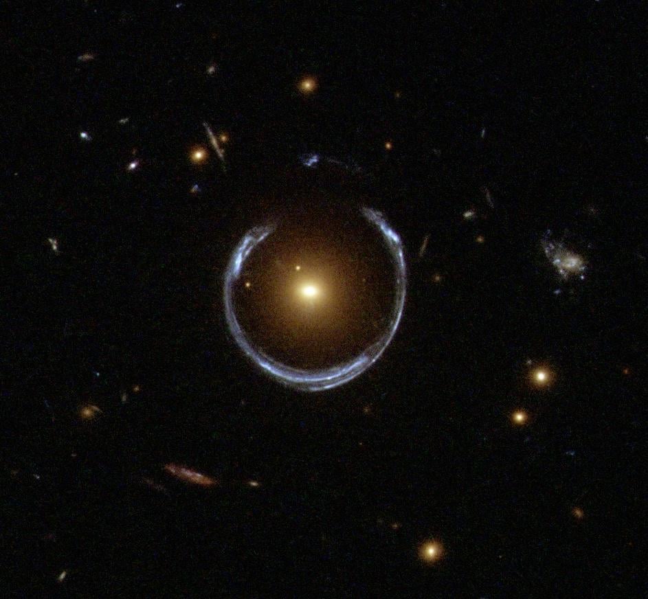 A 36 Billion Solar Mass Black Hole At The Center of a Luminous Red Galaxy With Einstein Ring