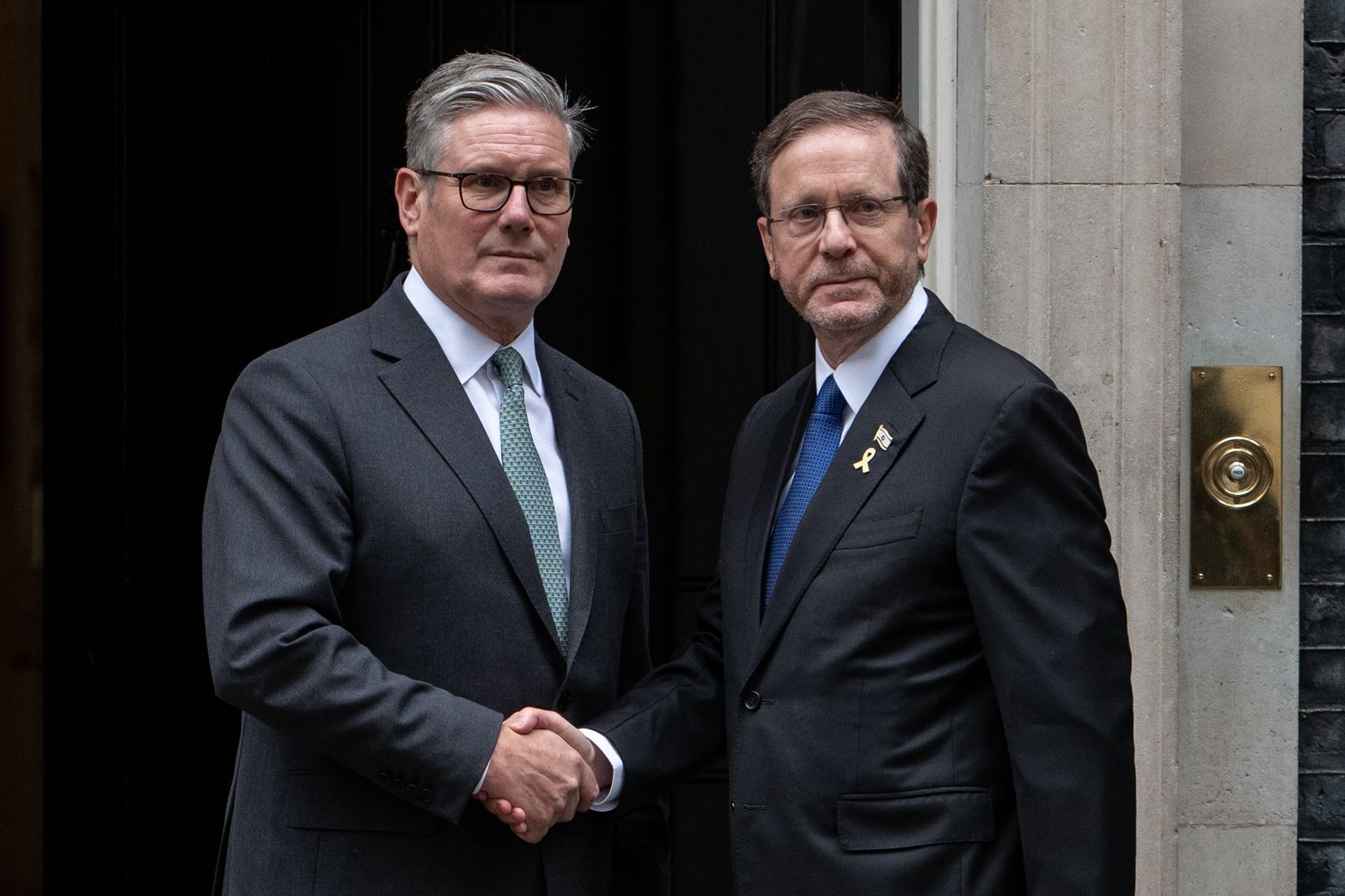 Keir Starmer and Isaac Herzog shaking hands outside 10 Downing Street.