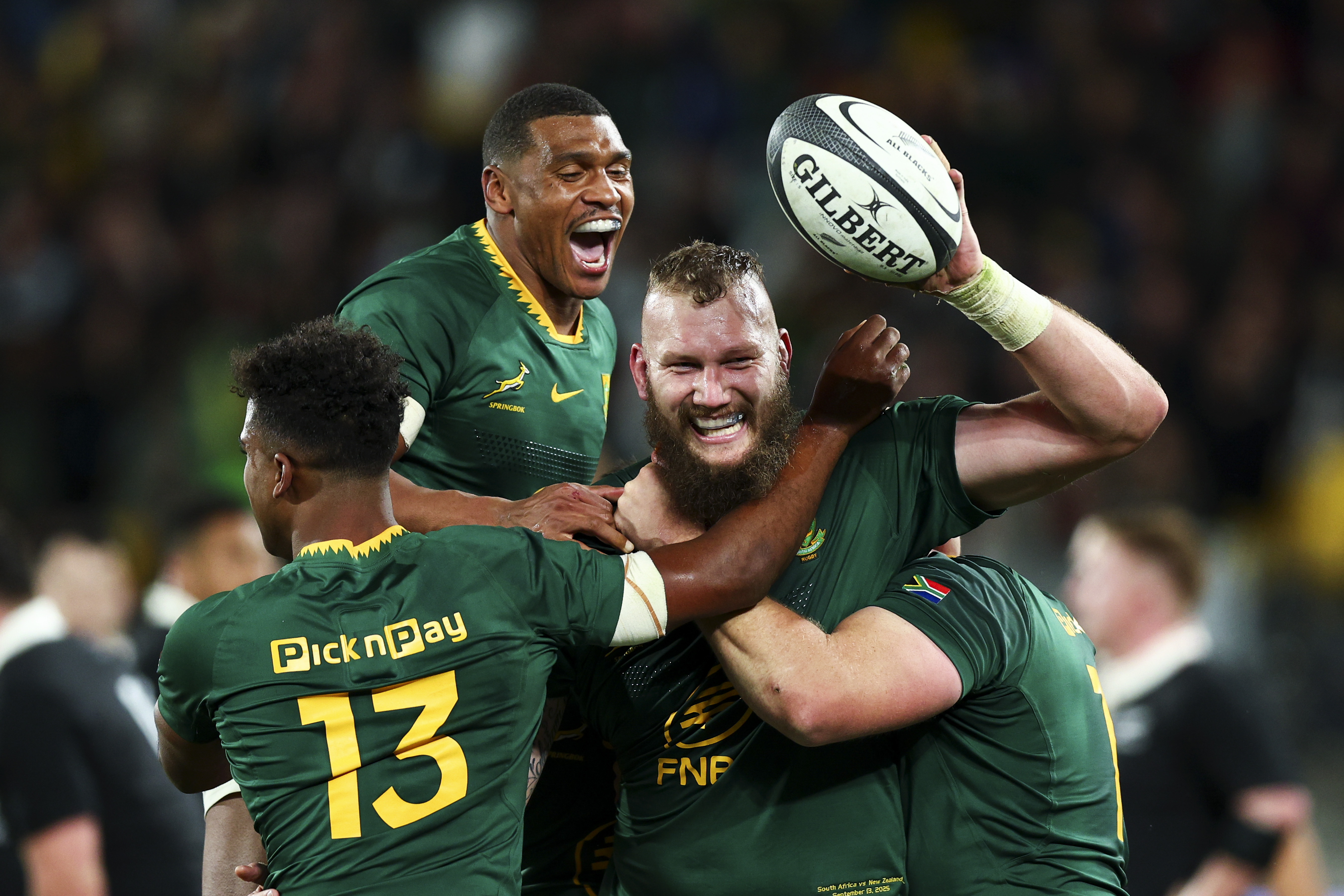 South African rugby players celebrating a try.