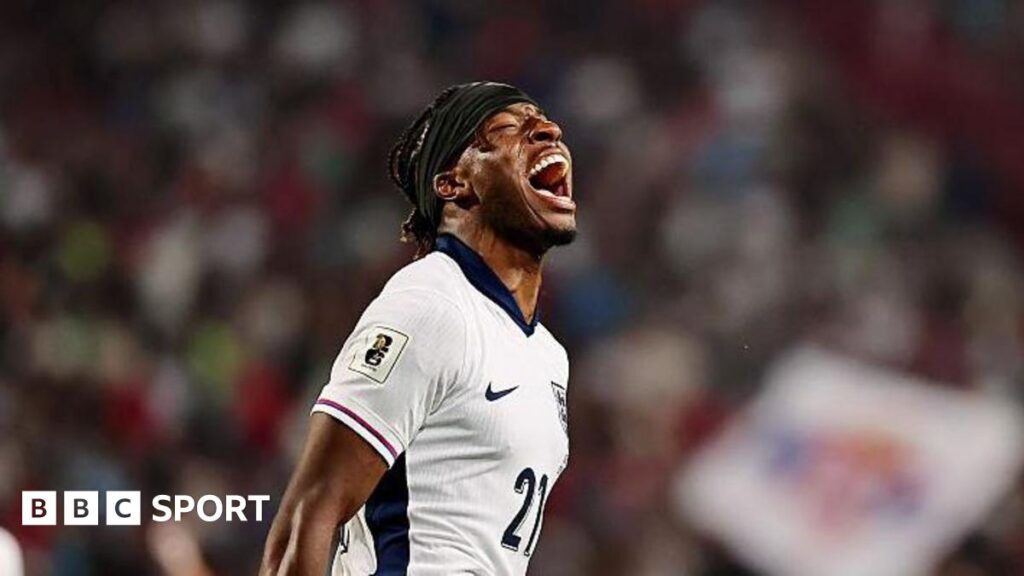 Noni Madueke celebrates after scoring his first international goal in England's World Cup qualifier in Serbia