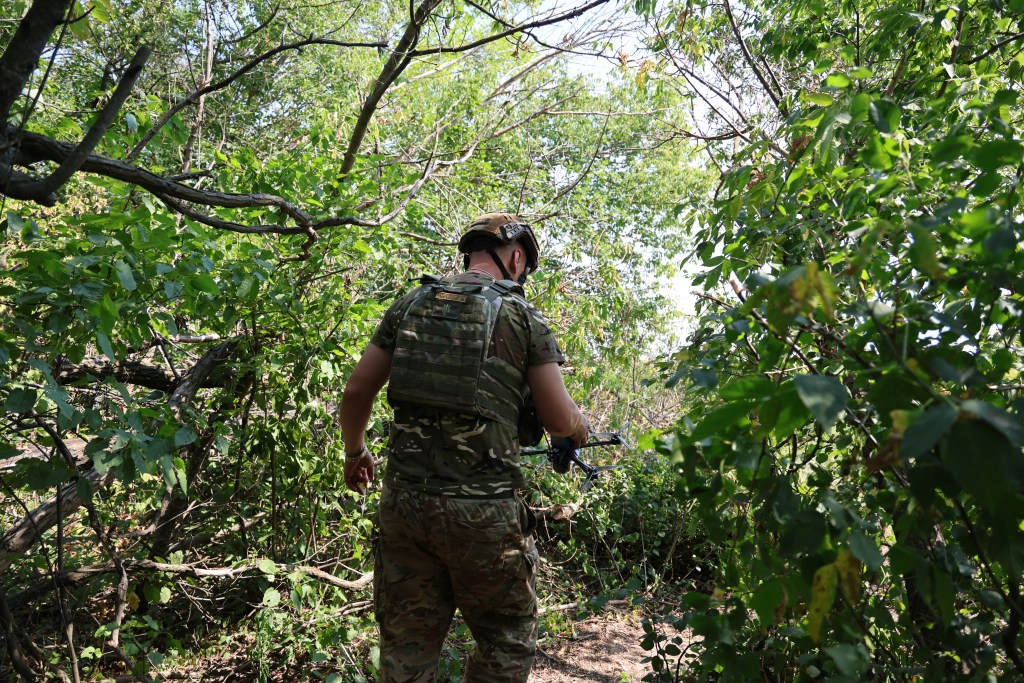 Photo: Serhii from Ukraine’s 110th Separate Mechanized Brigade leaves the trench to deploy an FPV drone. Credit: Courtesy of David Kirichenko