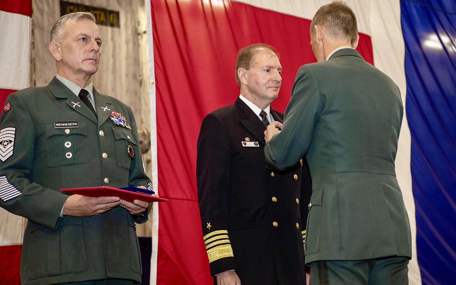 A service member is awarded a medal.