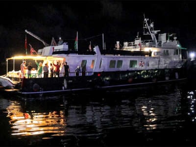 This grab from AFPTV footage shows activists riding aboard the British-flagged yacht Alma, which is part of the international flotilla for Gaza.