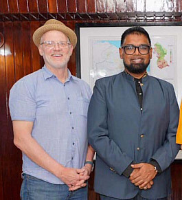 C. Thomas Lewis and Guyana's President Irfaan Ali.