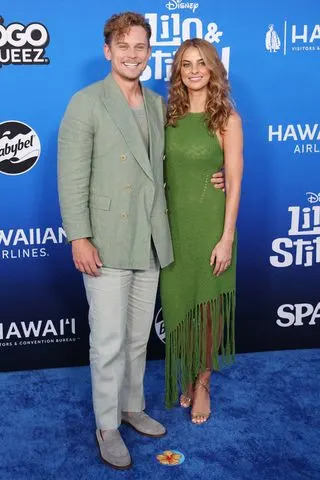 MICHAEL TRAN/AFP via Getty Billy Magnussen and Erica Firestone at the 'Lilo & Stitch' premiere in L.A. on May 17, 2025