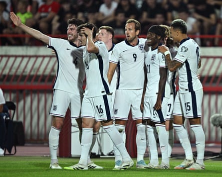 Noni Madueke celebrates with Harry Kane, Morgan Rogers, Tino Livramento, and Declan Rice after scoring the second goal during the World Cup 2026 qualifier match between Serbia and England