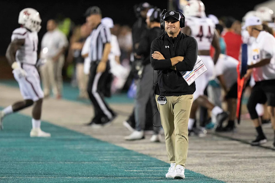 Sep 10, 2022; Conway, South Carolina, USA; Gardner-Webb Runnin Bulldogs head coach Tre Lamb walks the side lines in a game against the Coastal Carolina Chanticleers at Brooks Stadium. Mandatory Credit: David Yeazell-USA TODAY Sports
