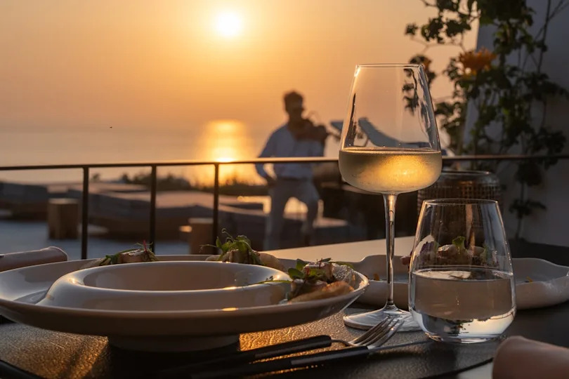 Dine at Alios Ilios as the sun sets (Santo Collection)