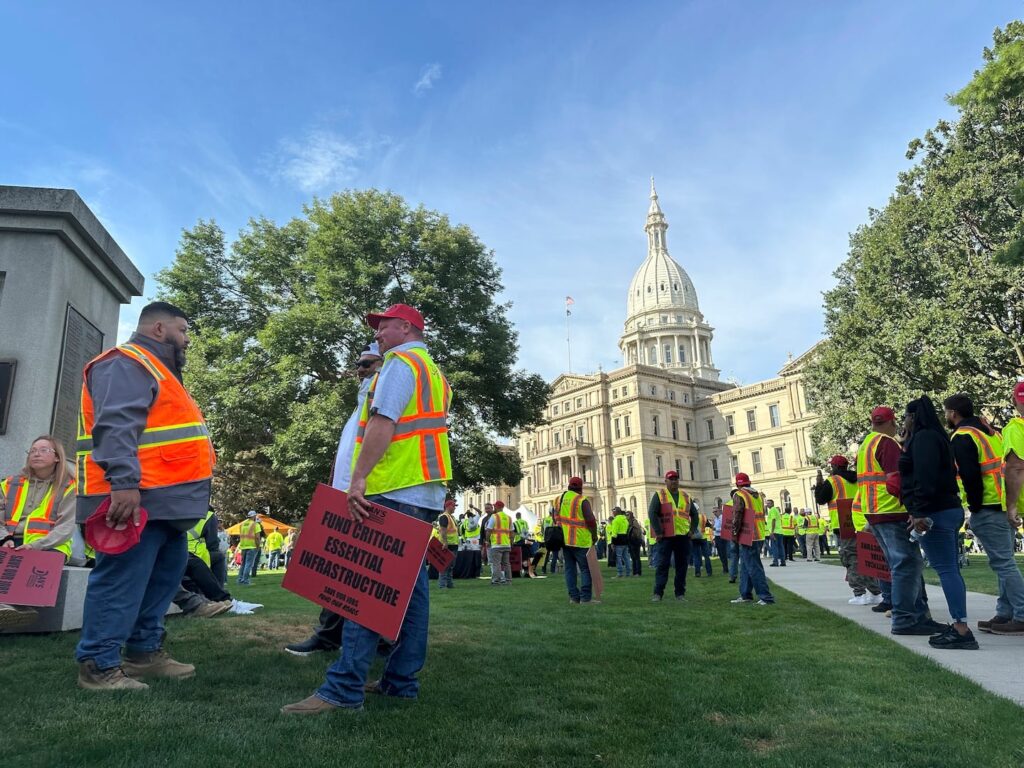 Construction workers gather at Michigan's statehouse in Lansing, Mich., Sept. 3, to call for a long-term road funding solution as a state government budget deadline approaches.