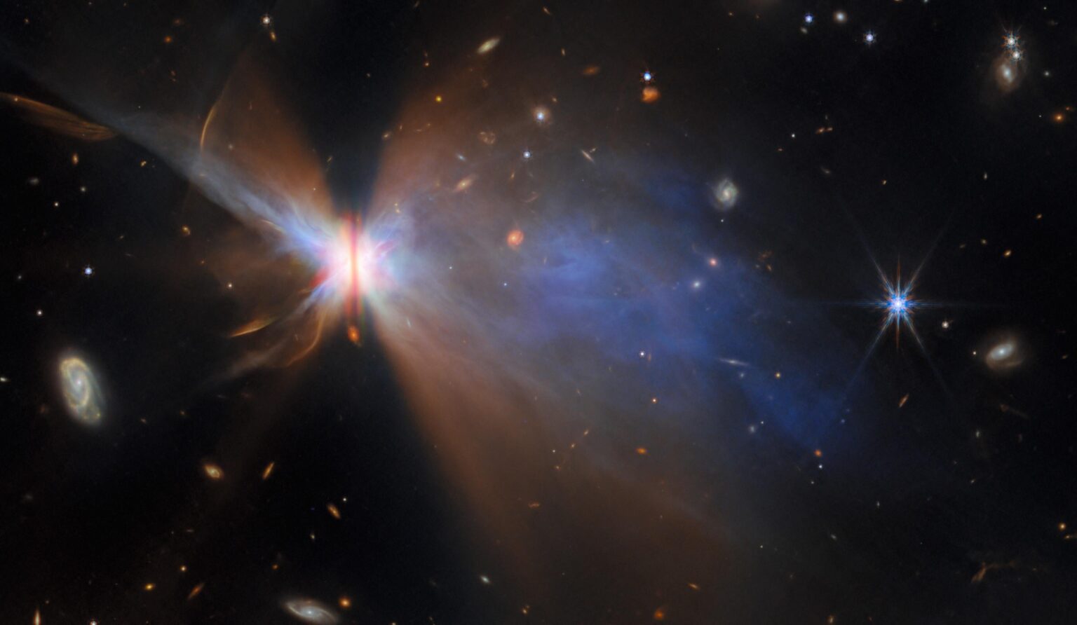 “A butterfly in the sky” - A protostar in the Taurus stellar nursery surrounded by a planet-forming disk (the dark stripe) 65 billion km across, allowing its light to fan out and illuminate the two wing-like nebulae on either side