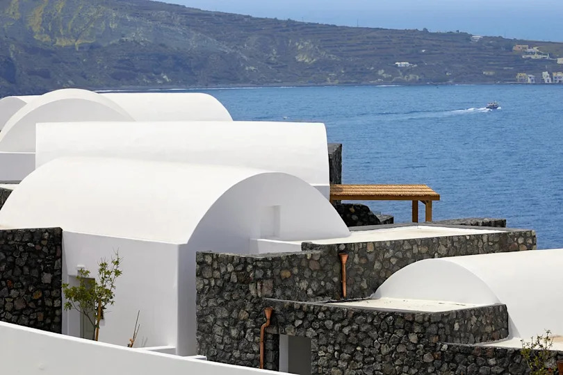While the resort does not have a beach, suites still have a prime view over the sparkling Aegean (Santo Collection)