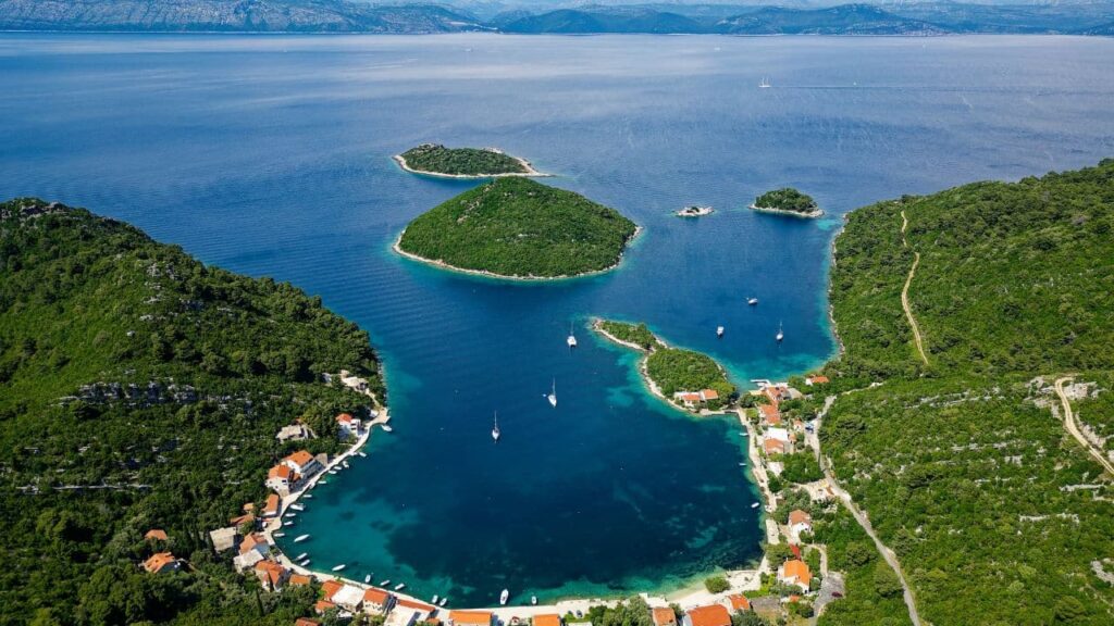 Croatia’s Coastline Is Calling: Where to Go Beyond Dubrovnik A bay in Mljet Island, Croatia. Tourist destination in the Adriatic sea. Beautiful place for summer holidays and vacations. Boats and yachts docked in the bay.