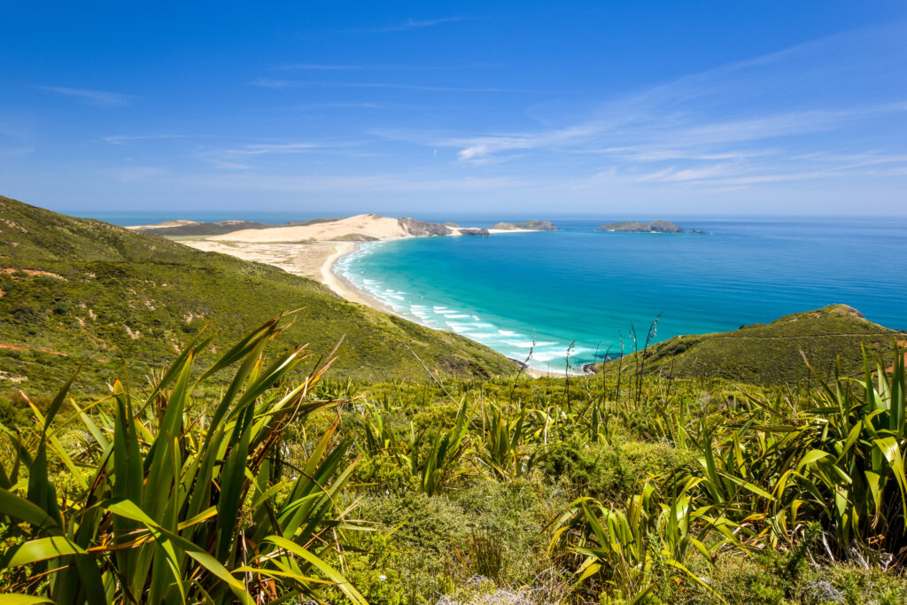 | Farmers Weekly view of Cape Reinga, the northernmost point of the North Island of New Zealand. Cape Reinga with its beautiful beaches, coastline and the lighthouse is a famous tourist destination